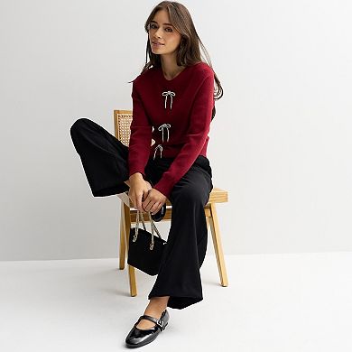 Juniors' madden girl Crewneck Embellished Bow Placket Sweater