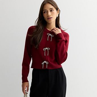 Juniors' madden girl Crewneck Embellished Bow Placket Sweater