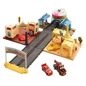 Mattel Disney and Pixar's Cars Radiator Springs Tour Playset with 2 Toy Cars