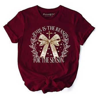 Jesus Is the Reason Christmas T‑Shirt, Coquette Gold Bow Cross Tee for Faithful Women