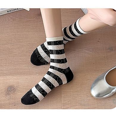 4 Pairs Women's Crew Socks with Black and White Patterns Soft Cotton Texture Heart and Stripe