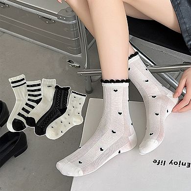 4 Pairs Women's Crew Socks with Black and White Patterns Soft Cotton Texture Heart and Stripe