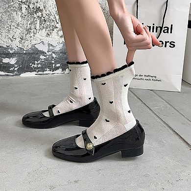 4 Pairs Women's Crew Socks with Black and White Patterns Soft Cotton Texture Heart and Stripe