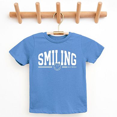 SmileyWorld Arched Varsity - Youth Short Sleeve Graphic T-Shirt