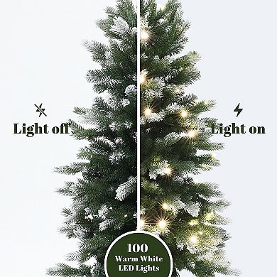LuxenHome 4Ft Pre-Lit Green and Flocked Artificial Christmas Tree in Black Planter Pot