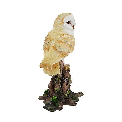 Barn Owl Vigilantly Perched on Tree Stump Statue