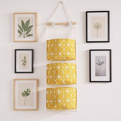 3-Piece Hanging Wall Organizer with Three Fabric Pockets and Wooden Rod Design