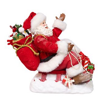 Kurt Adler 8.5-Inch Fabriché Santa Figurine Table Decor on Sled