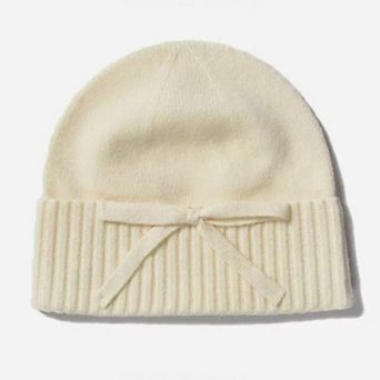 Women's Soft Knit Cuffed Beanie Hat with Ribbed Foldover Hem and Delicate Bow Detail