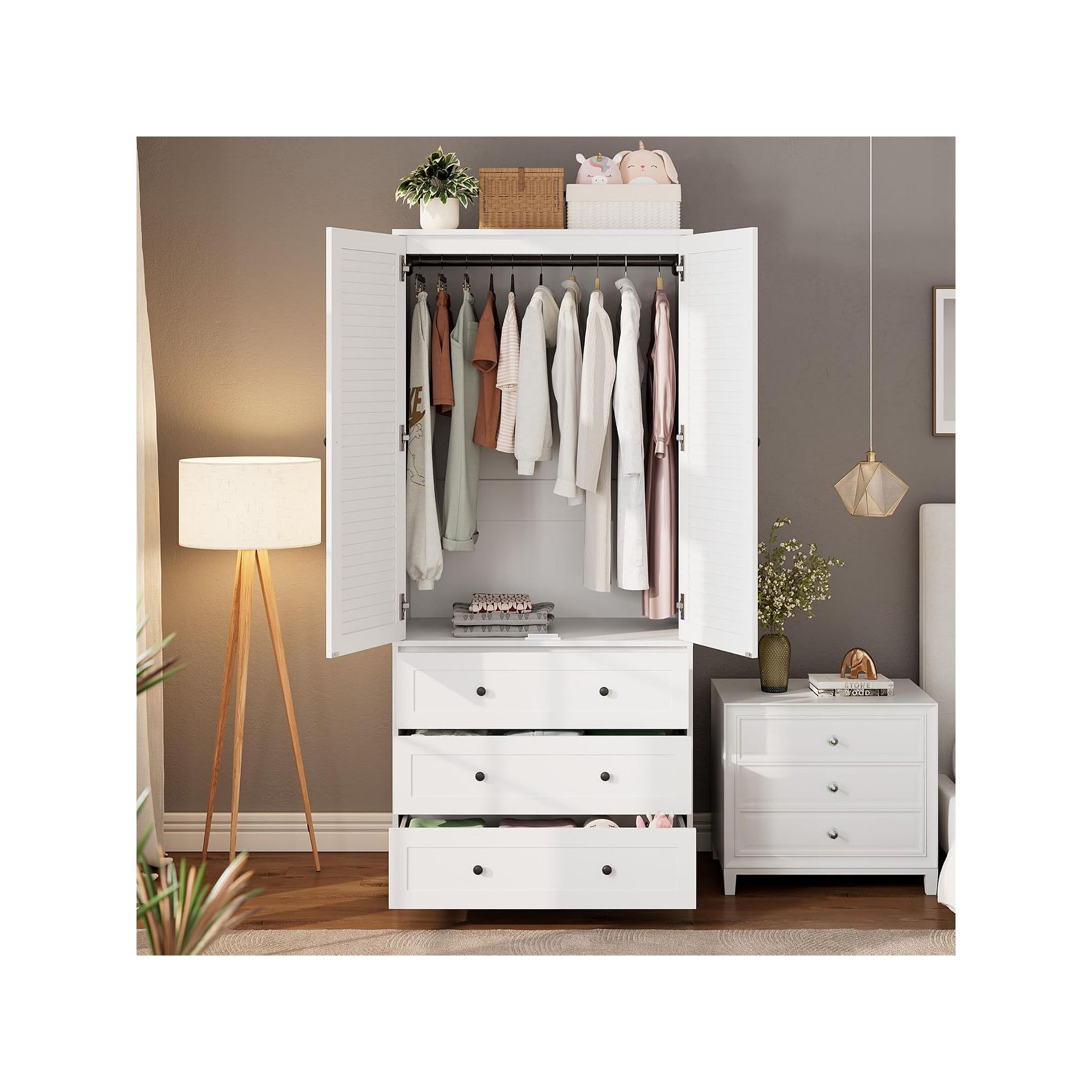 White louvered door wardrobe open with hanging rod and drawers