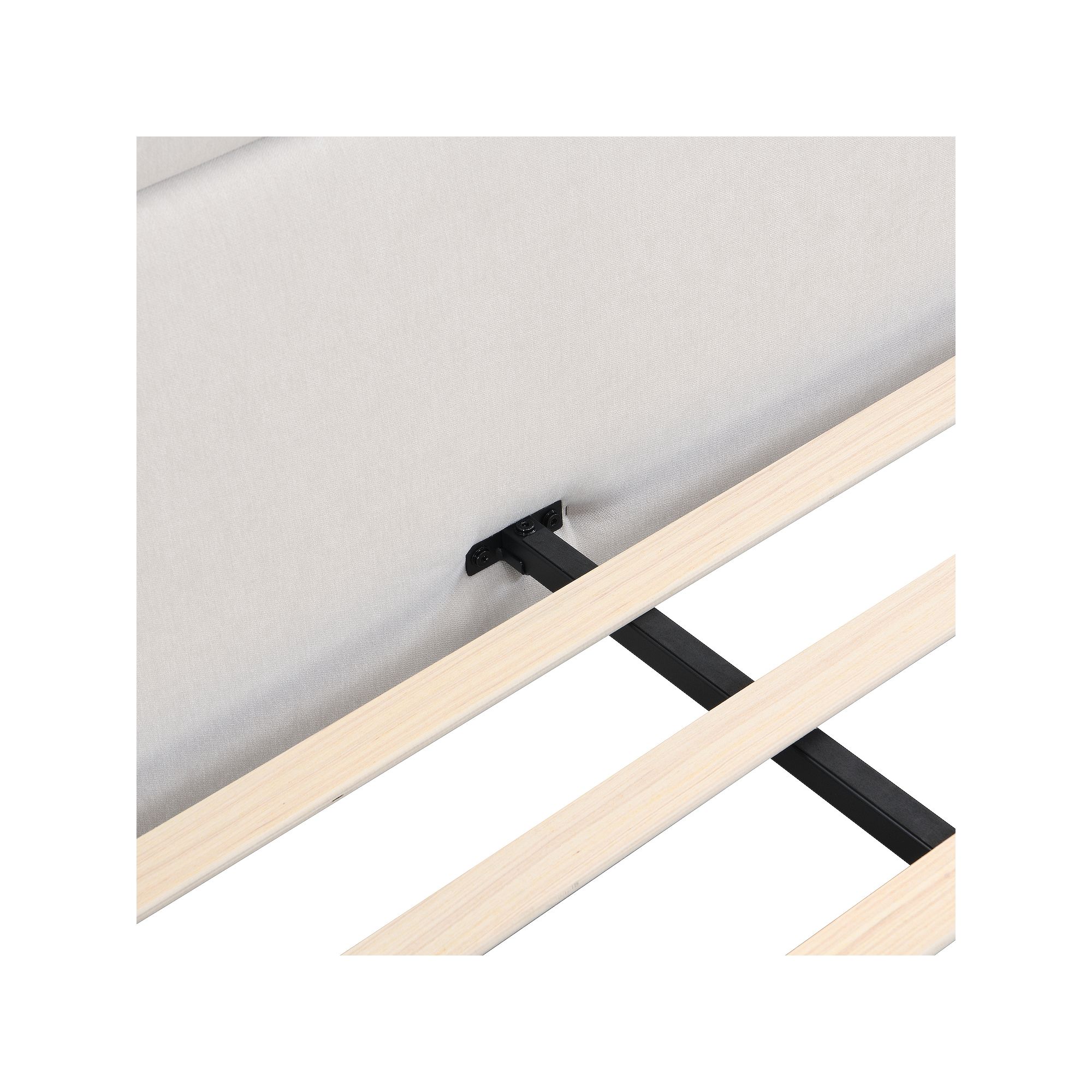 Close-up of reinforced wooden slats attached to upholstered bed frame