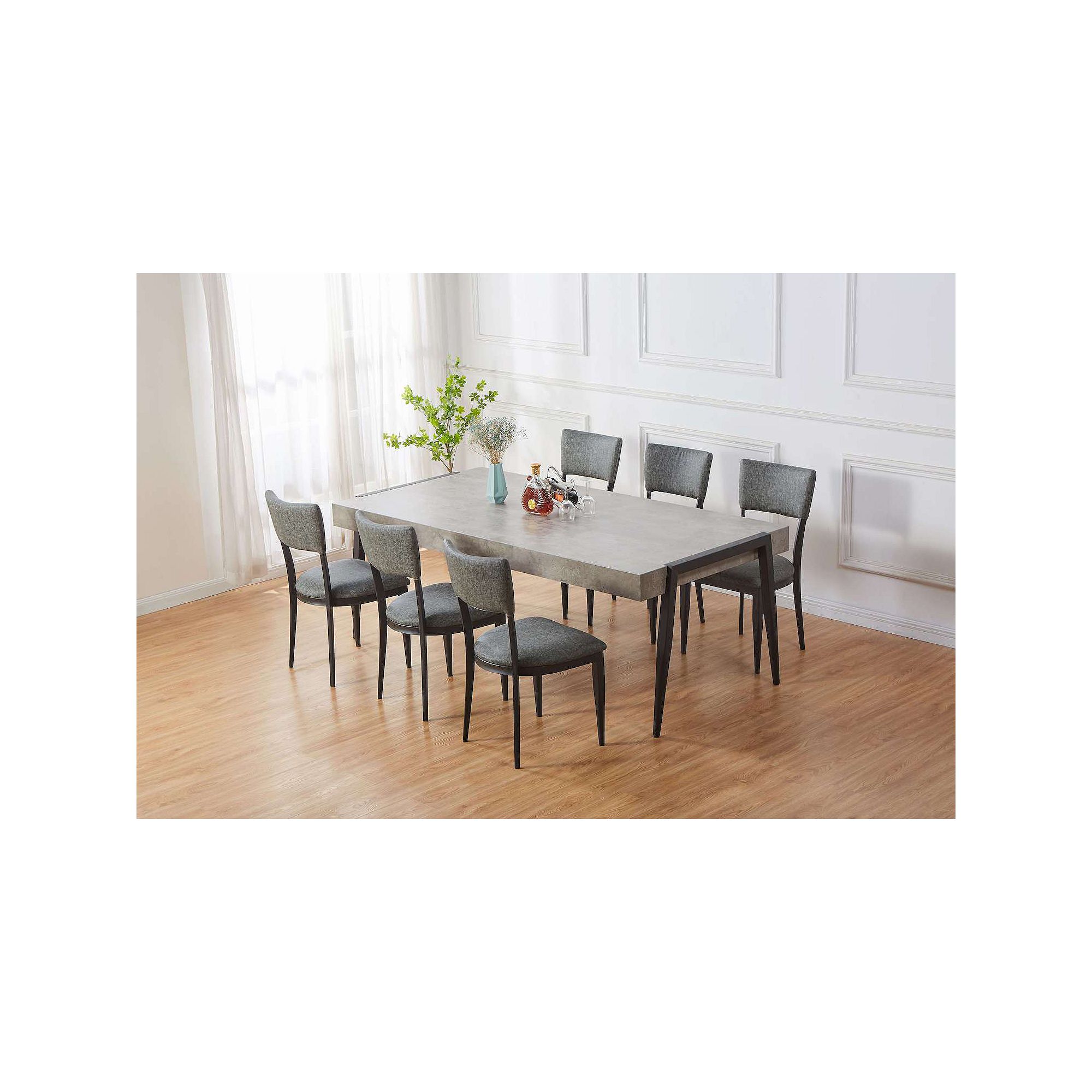 Marble-finish dining table with black metal legs shown with chairs