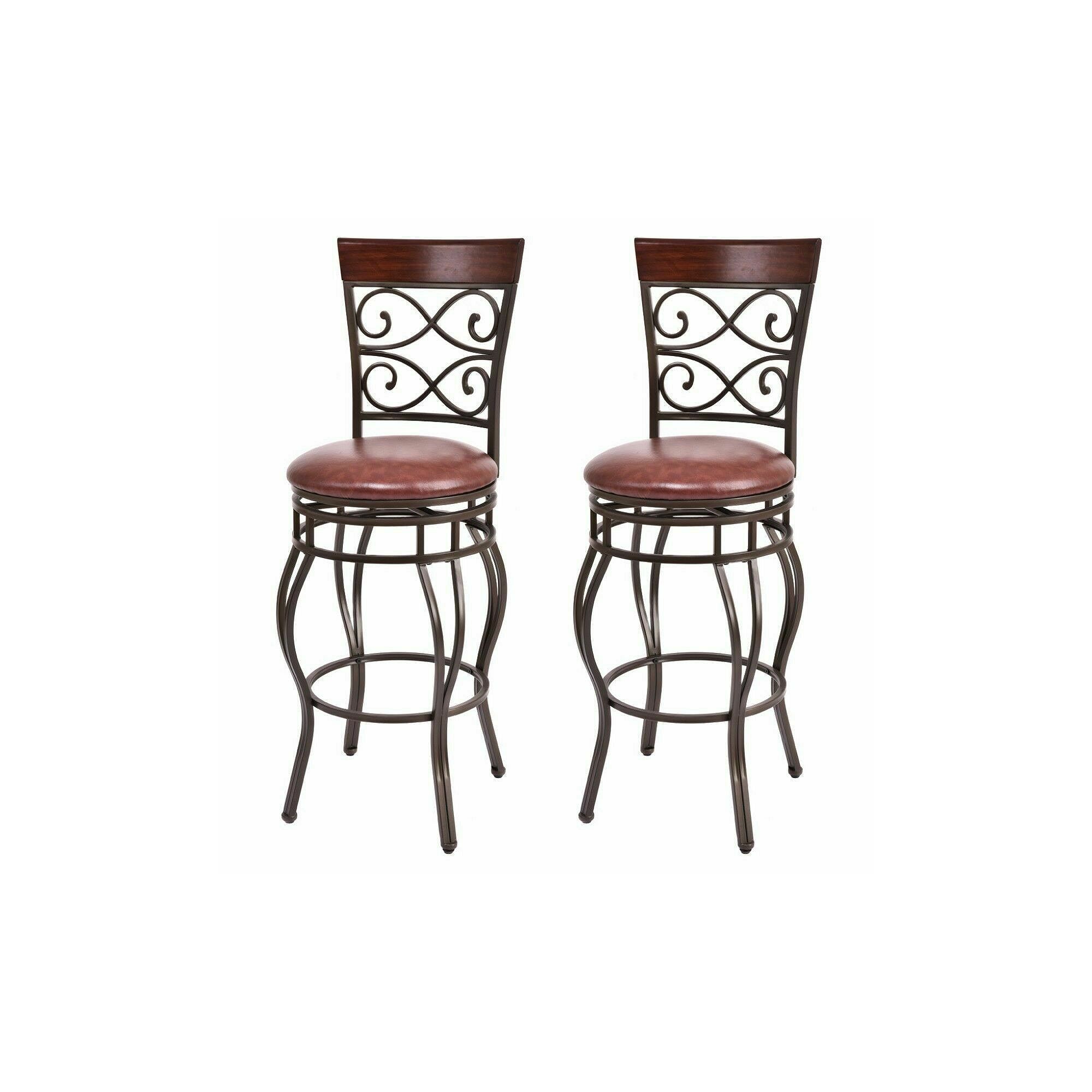 Set of two retro swivel bar stools with brown padded seats and dark metal frames