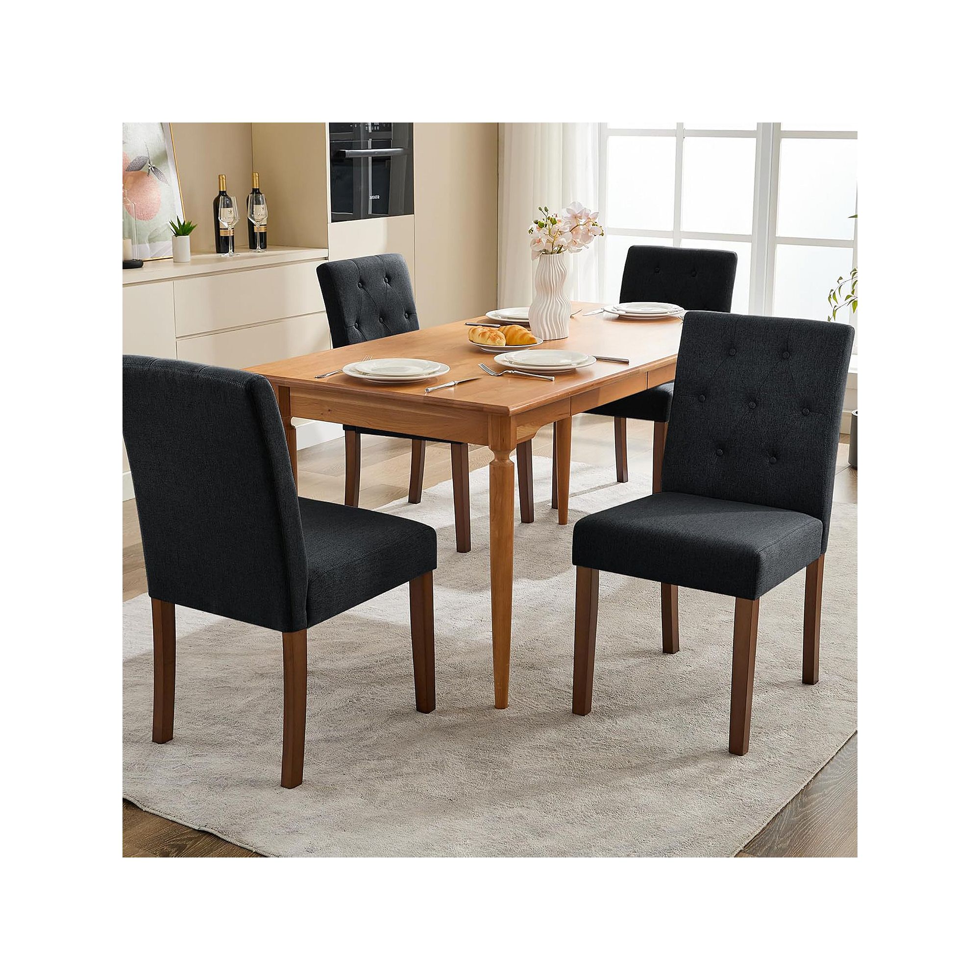 Set of upholstered parsons dining chairs with button-tufted backs