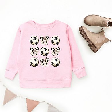 The Juniper Shop Soccer Ball Bows Stacked Youth Sweatshirt