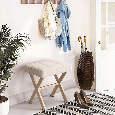 A compact stool with a padded seat and a metal X-shaped base; a vanity stool.