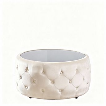 Modern round coffee table with velvet cushions and a tempered glass top