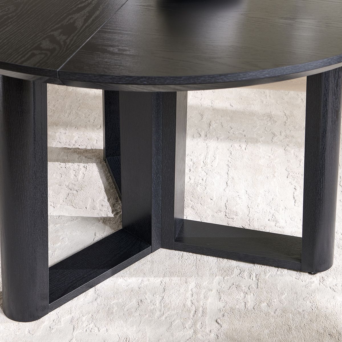 Underside view of round dining table pedestal base