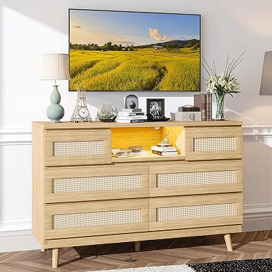 6-drawer rattan dresser features LED light, charging station & TV stand function.