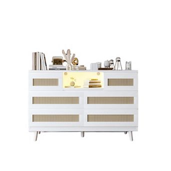6-drawer rattan dresser features LED light, charging station & TV stand function.