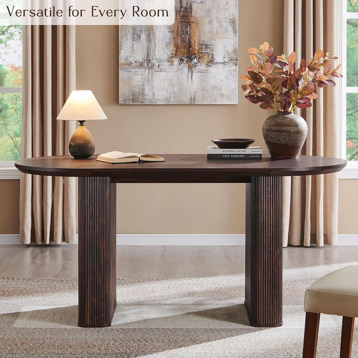 Oval dining table with decorative items in a living room