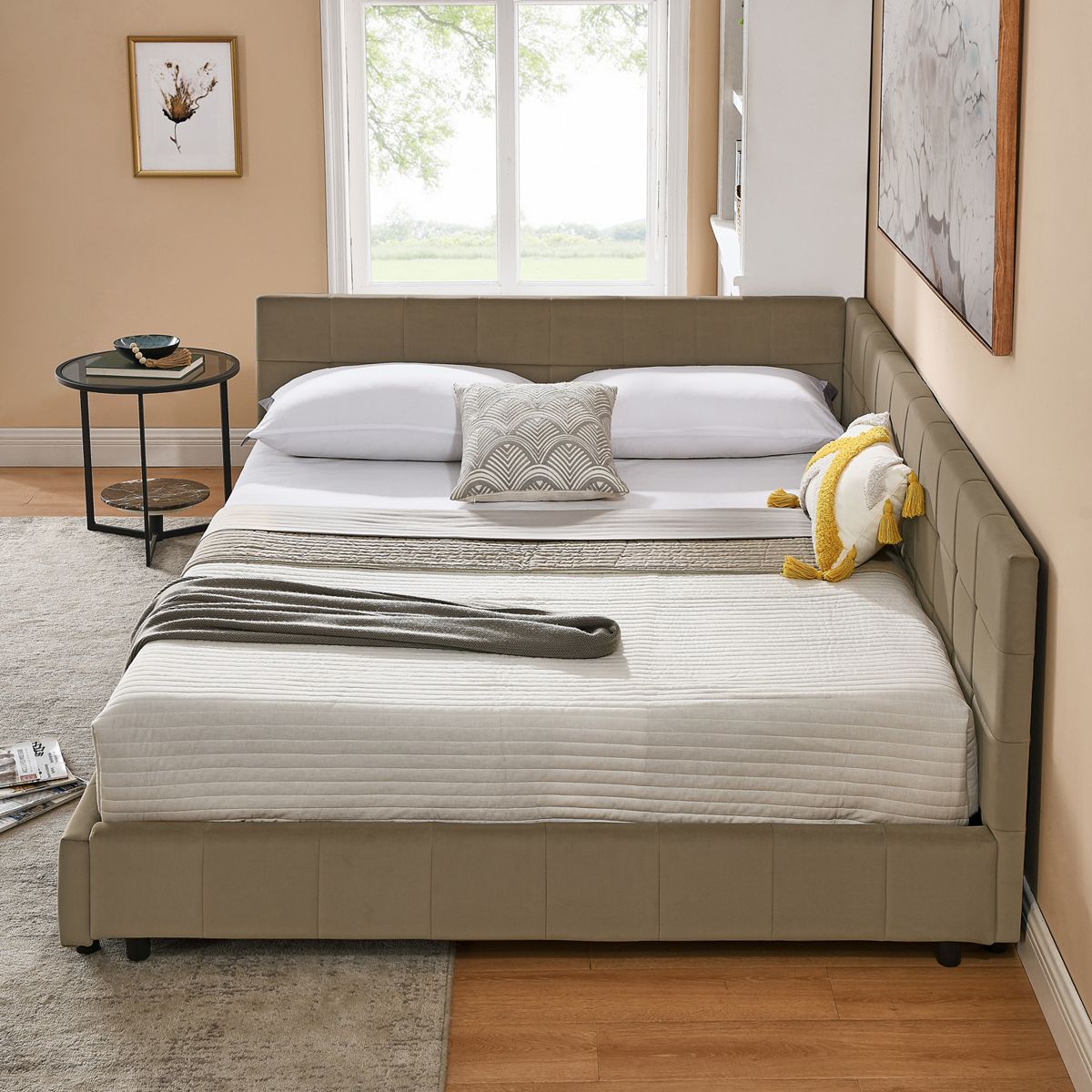 Olive green upholstered bed with pillows in a bright room