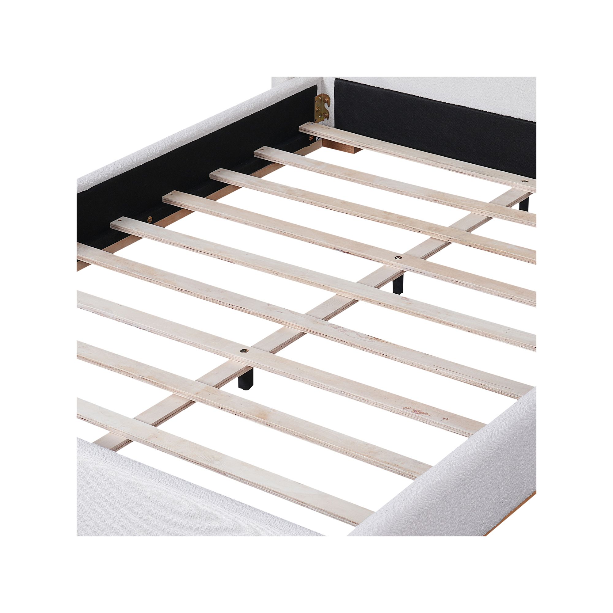 Close-up of platform bed slat support under upholstered headboard