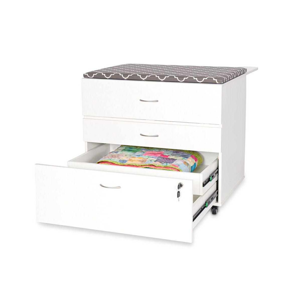 White embroidery storage cabinet with front drawer open and accessory storage tray