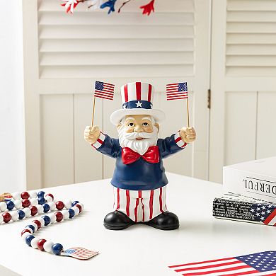 Glitzhome 9"H Patriotic/ Americana Polyresin Santa holding flags Table Decor