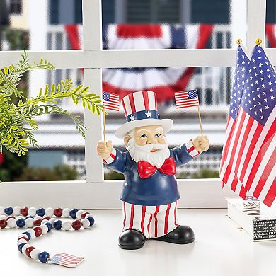 Glitzhome 9"H Patriotic/ Americana Polyresin Santa holding flags Table Decor