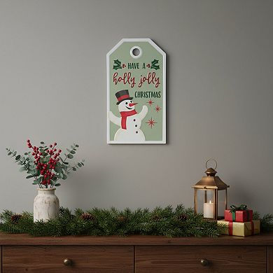 HomeRoots 16" X 9" Green And White Metal Christmas Snowman Hanging Wall Decor
