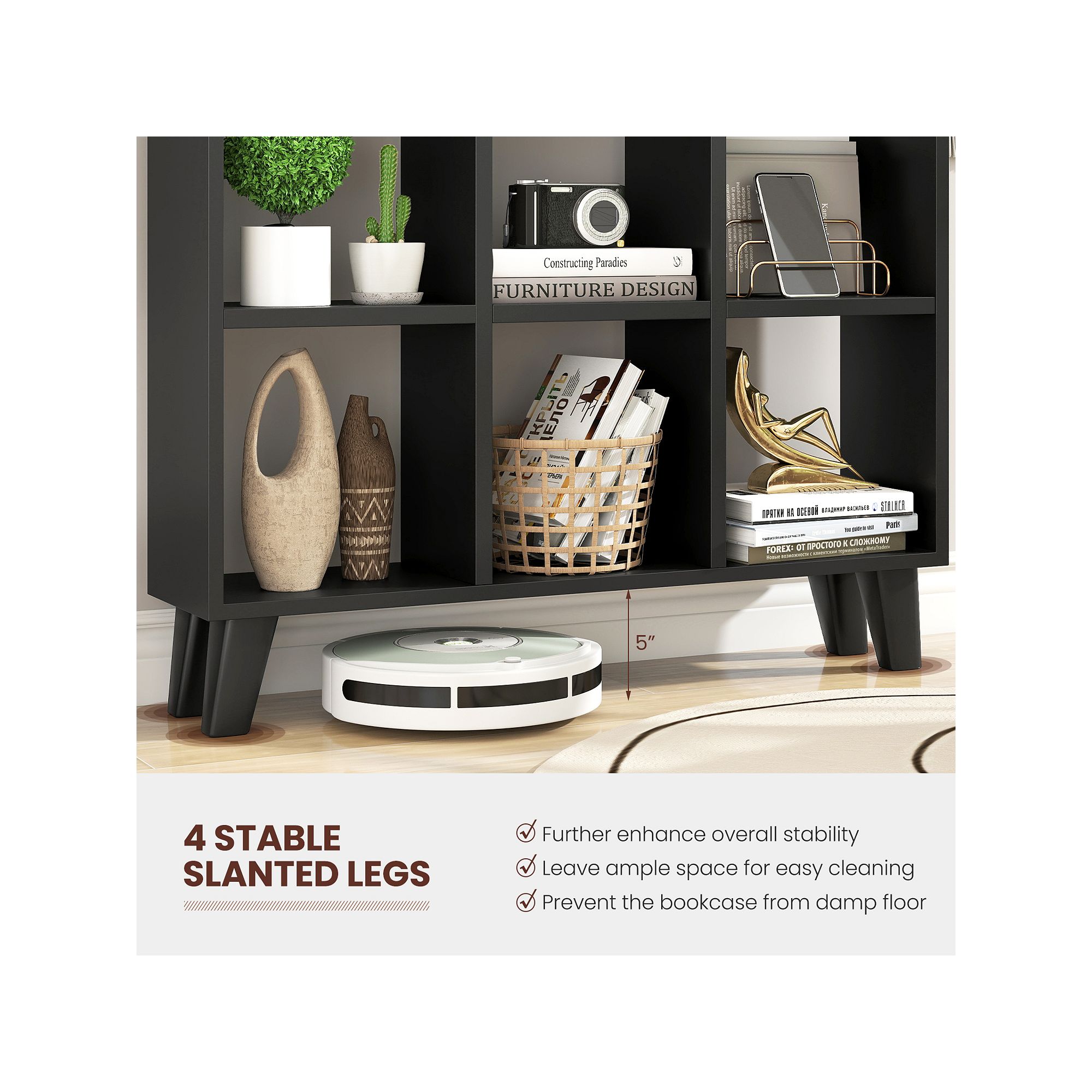 Close-up of a black cubby shelf showing decorative items and a robot vacuum nearby