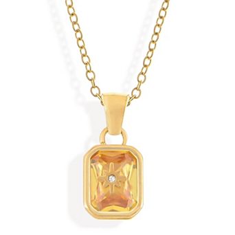 Gold Tone Pendant Necklace with Rectangular Crystal and Starburst Accent