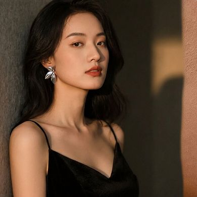 Women's Sculpted Leaf Drop Earrings with Polished Layered Petal Design and Bold Modern Silhouette