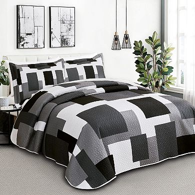 The geometric pattern is reversible on the bedspread set
