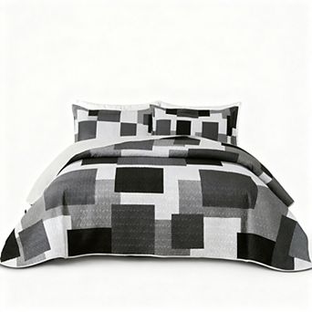 The geometric pattern is reversible on the bedspread set