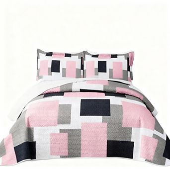 The geometric pattern is reversible on the bedspread set