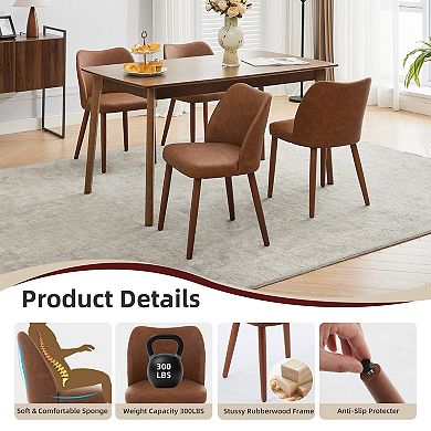 Set of 2 upholstered dining chairs with PU leather upholstery and wooden legs.