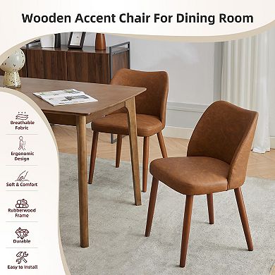 Set of 2 upholstered dining chairs with PU leather upholstery and wooden legs.