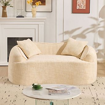 Beige curved double sofa with armrests on both sides and two cushions