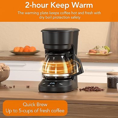 Compact coffee machine equipped with digital clock and programmable timer