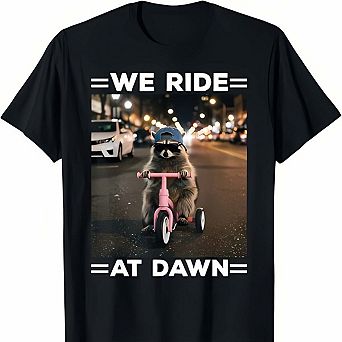 We Ride at Dawn Funny Raccoon Tricycle Graphic T Shirt Meme Humor Tee