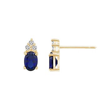 DIAMONBLISS Oval Cut Created Sapphire With Trio Lab Grown Diamond Accent Stud Earrings