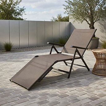 Foldable patio chaise lounge with backrest and footrest, brown outdoor recliner