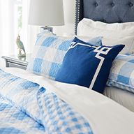 Blue throw pillows on bedset