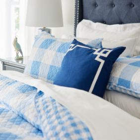 Blue throw pillows on bedset
