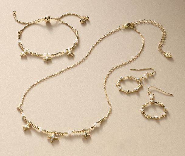 Fine bracelet, parasol earings, and strawberry pendant necklace