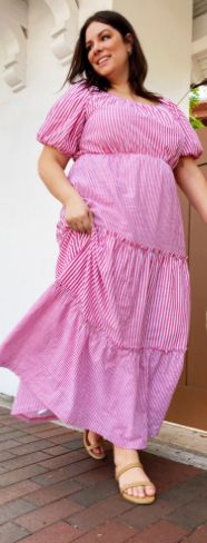 Woman wearing pink pinstripe sundress