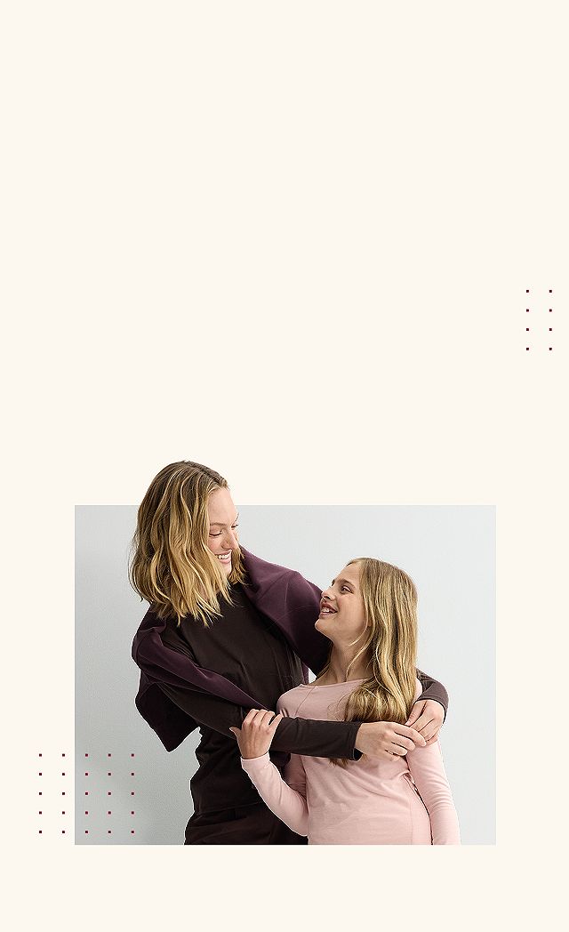 Mother hugging daughter