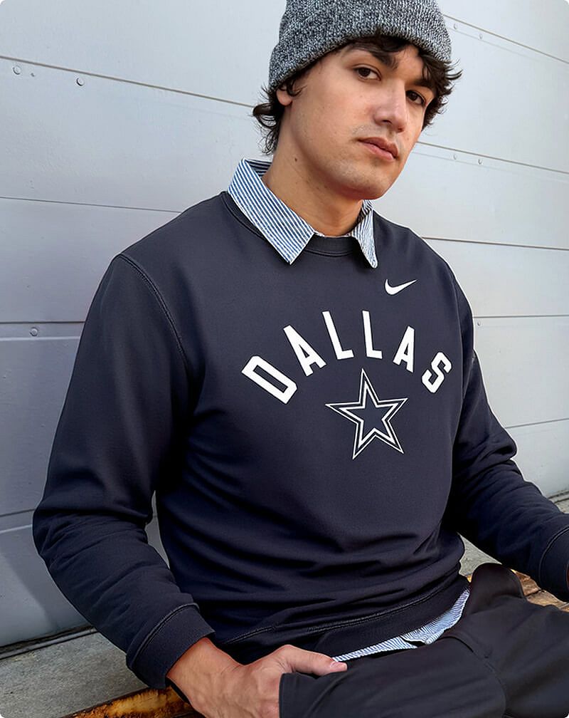 Man wearing NFL Dallas Cowboys sweatshirt